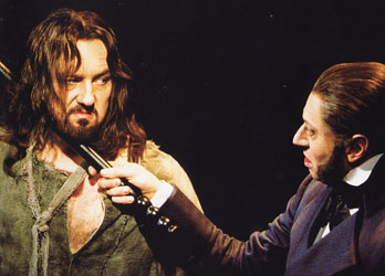 John Owen-Jones as Jean Valjean and Hans Peter Janssens as Javert.